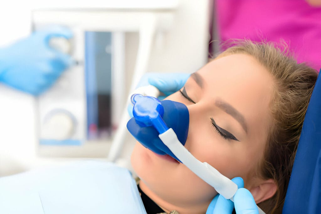 person with sedation gas mask on her face
